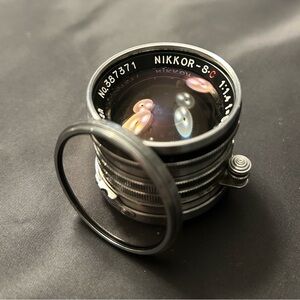 Nikkor-SC Vintage Camera Lens silver/black lwith lens cap clear/black